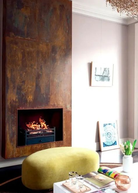 a bold glam modern living room with a hearth surrounded with aged metal for a unique and outstanding look Contemporary Gas Fireplace, Design Camino, Metal Fireplace, Contemporary Fireplace, Luxe Interiors, Home Fireplace, Modern Fireplace, Design Del Prodotto, Fireplace Wall