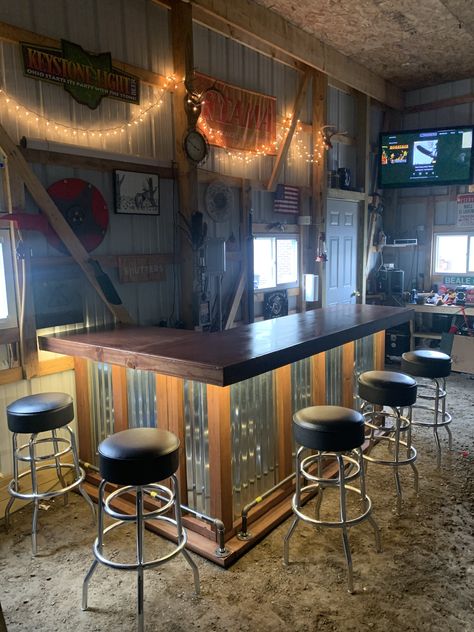 Built from scratch bar for pole barn. Shop With Bar Area, Pole Barn Wall Ideas, Pole Barn Bar Ideas, Pole Barn Man Cave Ideas, Pole Barn Bar, Garage Bar Ideas Man Caves, Man Cave Pole Barn, Frank Betz House Plans, Rustic Bar Ideas