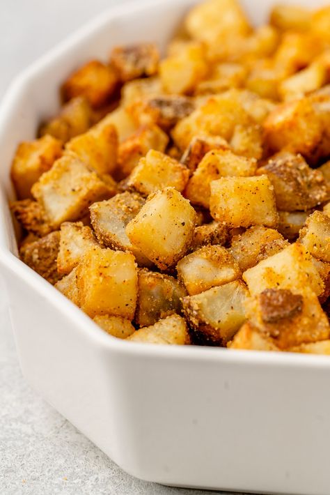 Learn how to make these crispy fiesta potatoes that are just like the ones from Taco Bell (but better). Super crispy with a hint of spice, these potatoes are perfect on tacos, in bowls, and salads too. #vegan #tacobell #copycat #recipe #potatoes #sweetsimplevegan #crispy Taco Bell Fiesta Potatoes, Taco Bell Potatoes, Fiesta Potatoes, Nacho Sauce, Taco Bell Copycat, Taco Bell Recipes, Potato Tacos, Seasoned Potatoes, Recipe Sweet