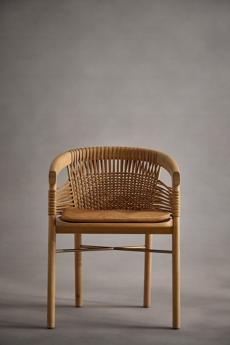 Entwine’s unique materiality and partial transparency bring warmth and interest to modern interiors. The epitome of Crafted Modern, the dining chair features a sculpted wood frame with refined tapered legs, paired with woven leather cord to form an enveloping, ergonomic curved back. Woven Dining Chairs, Cord Wood, Wooden Basket, Curved Back, Wood Dining Chairs, Leather Weaving, Modern Interiors, Modern Dining Chairs, Wooden Storage