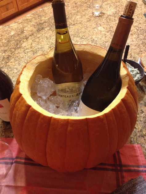 Pumpkin drink cooler  Cut the top off of a large pumpkin - focus on finding a wide one - and fill with ice and bottles. Naturally waterproof and doesn't sweat like regular buckets! So festive! Easy Thanksgiving Table Decor, Pumpkin Drink, Thanksgiving Table Decor Ideas, Fall Feast, Pumpkin Wine, Friendsgiving Dinner Party, Pumpkin Drinks, Thanksgiving Friendsgiving, Drink Cooler