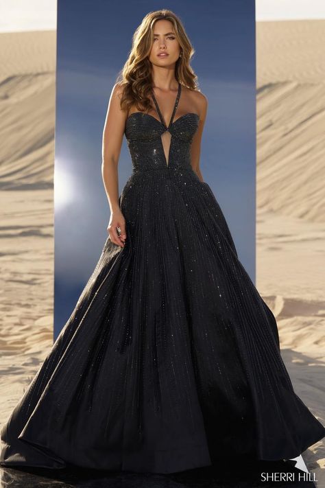 *Adds to Cart* Sherri Hill style 56815 is a showstopper, for sure! The shimmering hot fix ball gown features a fitted bodice with sheer keyhole detail. The straps give the illusion of a halter neckline, but actually criss cross in the back giving the bust some additional support. The sparkling heat stone embellishments adorn every element of the dress from the straps to the skirt, ensuring you'll be glistening all night long! Whether you're planning to wear it under the Friday night lights as you're crowned homecoming queen or while you take the crown at your next pageant, Sherri Hill 56815 is going to have every eye glued on you! Dress Shops, Homecoming Queen, Sherri Hill Prom, Princess Sleeves, Sherri Hill Prom Dresses, Prom Dress Stores, Prom Dress Styles, Designer Prom Dresses, Prom Designs