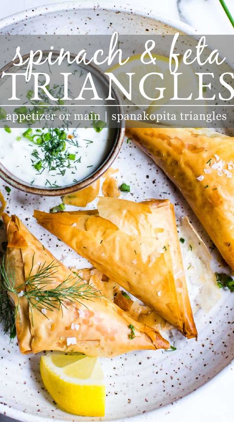 Spinach and Feta Triangles ( spanakopita triangles ) are crunchy little packets of spinach, feta, Parmesan, garlic and spices folded in phyllo dough. They can be made small or larger as an appetizer or light main. Spinach and feta parcels are made with simple ingredients and can be made ahead! Feta Parcels, Spanakopita Triangles Recipe, Spanakopita Triangles, Phyllo Appetizers, Spinach Appetizers, Spanakopita Recipe, Spinach Puff Pastry, Phyllo Dough Recipes, Spinach Puff