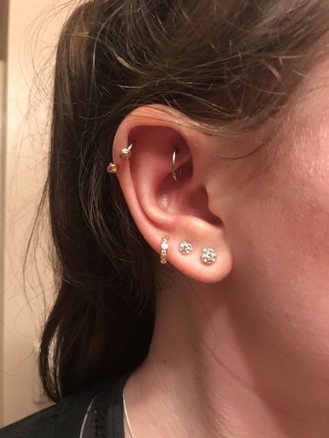 Ear piercings, rook piercing, triple lobe piercings, helix piercing, hoops and studs Triple Ear Piercing, Triple Lobe, Triple Lobe Piercing, Ear Piercings Chart, Double Ear Piercings, Gold Ear Jacket, Lobe Piercings, Helix Piercings, Piercing Inspo