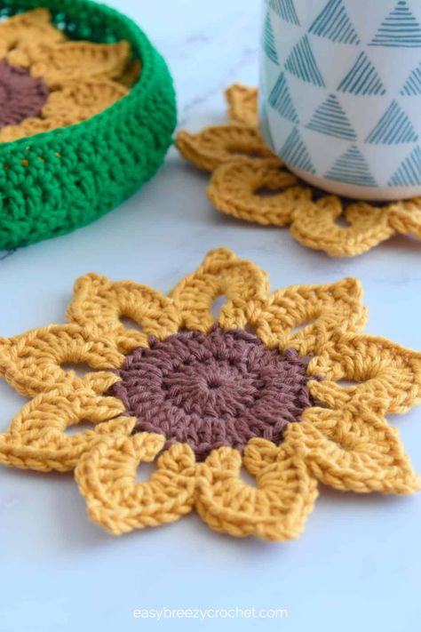 Mae's Flowers Crochet Patterns Roundup · Jo's Crafty Hook Crochet Coaster Holder Free Pattern, Small Cotton Crochet Projects, Crochet Coasters With Holder, Funny Crochet Patterns, Sunshine Crochet, Sunflower Coaster, Sunflower Coasters, Sunshine Crafts, Coaster Holders