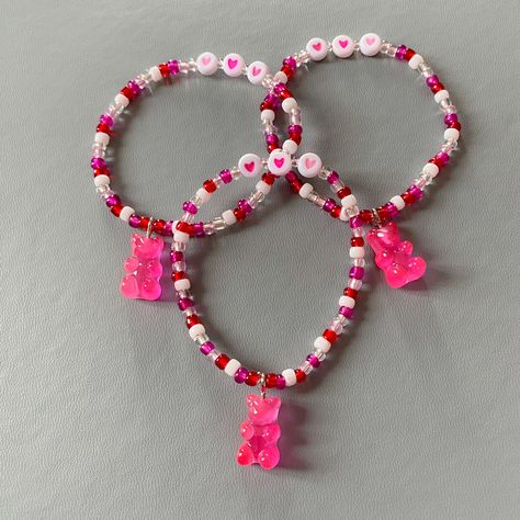 Made with 4mm pink, red and white seed beads. It has a pink resin gummy bear charm and love heart beads. Colours may vary very slightly from bracelet to bracelet. All my bracelets are made to a 7 to 7.5 inch length (which is the average female wrist size). If you require a different size please get in touch 💗 💜Orders containing multiple bracelets will be packaged together - if you would like them packaged separately, please let me know. Any other questions please message me 💜 The bracelet com Red And Pink Beaded Bracelet, Valentine's Day Pink Heart Beaded Bracelets, Valentine’s Day Beaded Bracelet, Valentine's Day Heart-shaped Colorful Beaded Bracelet, Pink Heart-shaped Bracelet With Colorful Beads, Red Heart-shaped Bracelet With Colorful Beads, Team Bracelets, Holographic Bag, Pink Beaded Bracelets