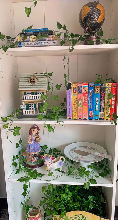 Vine Bookshelf, Vines On Bookshelf, Bookshelves Cottagecore, Bookshelf With Vines, Ivy Bookshelf, Fairycore Bookshelf, Book Shelf Insert Fairy, Harry Potter Office, Brown Bookshelves