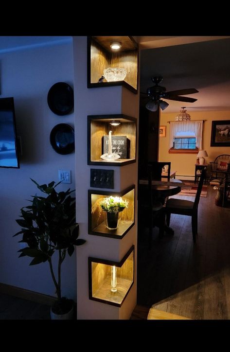 These are the shelves I made that went viral on tiktok. My customer had originally wanted to widen the doorway to her dining room, but the way the support for the second floor and plumbing chase was configured left us with this awkward corner that I couldn't take out without restructuring the house, which wasn't in the budget. I offered this solution to make the wasted space in the corner look like less of a design flaw and everyone loves the new addition. Doorway Corner Decor, Odd Corners In Living Room, Beautiful Corners In The House, Awkward Hallway Ideas, Awkward Corner Decor, Corner Wall Decorating Ideas, Tv Stant, Corner Shelves Design, Pillar In Living Room