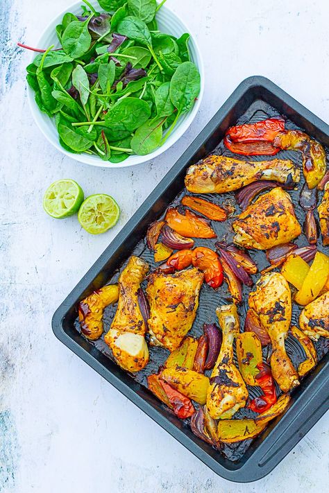 Love Nando's? Then you are going to ADORE this Peri Peri Chicken Traybake! Simply coat chicken and vegetables in an easy homemade Peri Peri Marinade… then throw everything into one tray and roast for 45 minutes. Quick, easy, super tasty… and best of all, only one pan to wash up! #nandoschicken #homemadenandos #periperichicken #chickentraybake #traybake #sheetpandinner #easymidweekmeals #midweekmeals #easydinners #dinnertonight #dinnertonite #familydinners #familyfood #easypeasyfoodie Peri Peri Rice Bake, Peri Peri Chicken Tray Bake, Peri Peri Chicken Side Dishes, Mediterranean Chicken Tray Bake, Peri Peri Marinade, Chicken Peri Peri, Chicken Traybake, Chicken Tray Bake, Peri Chicken