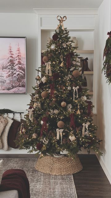 Evelyn Hernandez on Instagram: "A look at my Christmas tree this year ♥️   Couldn’t be happier with how it came out! Im loving the red so much. Last year, I added some baby’s breath stems from Hobby Lobby in the color beige and brown so I added them again this year! Also added pops of red with some red flocked ornaments and red ribbon! Love it so much.   Check out my newest video on Youtube to see a more in detail look of how I decorated it, link is in bio 🫶🏼   #christmastreereveal #christmastree #redchristmastree #redchristmas #christmas2024 #christmasinspiration #homealonechristmas #treereveal #christmasinspo #ltk #ltkhome #neutralchristmas" Red Brown Cream Christmas Tree, Tan Christmas Tree Decor, Boho Frosted Christmas Tree, Neutral Christmas Tree Pops Of Red, Christmas Tree With Brown Bows, Red And Tan Christmas Tree, Neutral Red Christmas Tree, Red And Beige Christmas Tree, Rustic Woodsy Christmas Tree