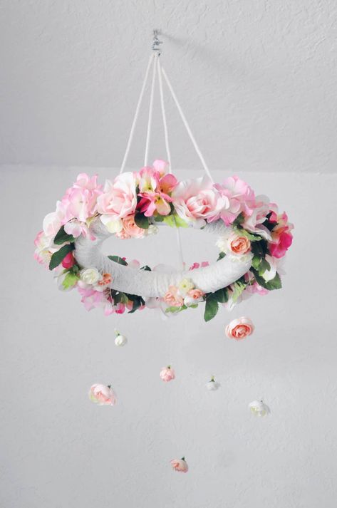 This DIY mobile for a baby girl's nursery is the perfect DIY Nursery Decor item to finish your room.  Check out a full round up of Nursery DIY's to see more on this flower Mobile. https://arinsolangeathome.com #DIY #NurseryDIY #GirlNursery #DiyDecor Diy Flower Mobile, Diy Nursery Decor Girl, Diy Nursery Decor, Girl Nursery Themes, Floral Nursery Decor, Nursery Decorations, Flower Mobile