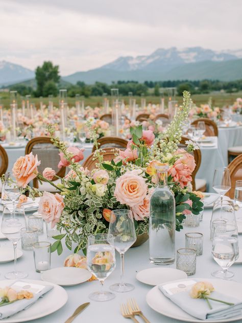 Pink peach rose, peach ranunculus, white delphinium, apricot tulips, peach lisianthus, white cosmos, pink coral garden rose, feverfew chamomile - gold bowl - round table centerpiece Wedding Florals Round Table, Centerpiece Wedding Round Table, Coral Pink And Gold Wedding, Wedding Round Table Flowers, Wedding Table Decorations Peach, Peach And White Wedding Centerpieces, Gl Wedding, White And Peach Centerpieces, Peach And White Wedding Flowers