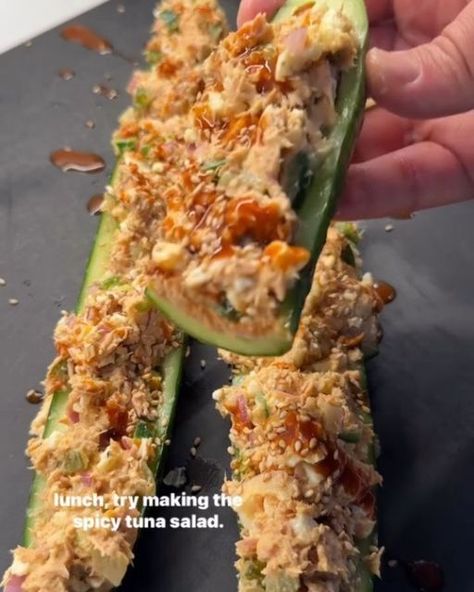 Healthy Eating on Instagram: "Say "YUM" if you would eat these TUNA CUCUMBER BOATS 🔥by @shredhappens  If you missed meal prep, or you want to pull something together in no time that packs a ton of protein, try making this easy spicy tuna salad. It packs 51g protein and just 500 calories. I scooped it over a hollowed out English cucumber, but you can use lettuce, bell pepper, sourdough, or any type of vessel you wish!  Ingredients: 2 cans tuna (7oz total) in water 2 medium boiled eggs 1/2 jalapeño, finely diced (deseed if you want less heat) 1/4 cup finely diced dill pickles 1/2 small red onion, diced and soaked in water for 10 mins to mellow out the sharp flavor 1 tbsp Dijon mustard 1.5 tbsp mayo 1 tbsp sriracha or hot sauce Salt & pepper to taste 1 English cucumber 1 tsp sesame seeds & c Spicy Tuna Cucumber Boats, Tuna Cucumber Boats, Tuna Cucumber, Cucumber Boats, Spicy Tuna Salad, Tuna Boat, Medium Boiled Eggs, Protein Meal, Tuna Melts