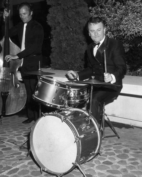 Bob Crane (from Hogans Hero's) was an avid drummer and brought his kit to just about every place he traveled too!  By all accounts he was VERY good!!!  Yup, he's a player! Bob Crane, Hogan's Heroes, Hogans Heroes, Pow Camp, Playing Drums, John Henry, Comedy Tv, Backstreet Boys, Vintage Drums