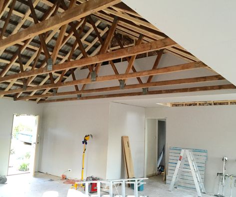 Want exposed beams in your house? Here's how... Trussed Ceiling Exposed Beams, Exposed Wood Trusses Ceiling, Partial Vaulted Ceiling Living Room, Vaulted Truss Ceiling, Exposing Beams Ceiling Diy, Exposed Garage Ceiling, Roof Beams Exposed, Ceiling Trusses Exposed, Roof Truss Design Exposed Beams