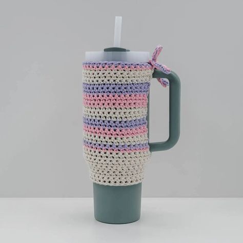 "The super popular Stanley Tumbler is already fantastic, but you can elevate its uniqueness with a personalized crochet cozy, holder, or boot. The Striped Crochet Stanley Quencher Cozy pattern provides a fun way to personalize your Stanley Quencher.  All you need is some leftover cotton yarn and a bit of time to create this charming accessory effortlessly.  Just grab your crochet hook and yarn, and begin giving your Stanley cup a unique flare that’s sure to catch eyes.  " Crochet Stanley Cup Holder Free Pattern, Crochet Stanley Cup Accessories, Crochet Cup Holder, Crochet Hook And Yarn, Religious Christmas Crafts, Christmas Stockings Sewing, Christmas Crafts Snowman, Kids Christmas Coloring Pages, Sewn Christmas Ornaments