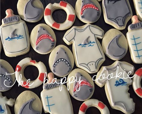 Shark baby shower sugar cookies Baby Shark Nursery Theme, Shark Themed Baby Shower Ideas, Shark Baby Shower Theme, Shark Gender Reveal, Shark Baby Shower Ideas, Jaws Party, Surfer Baby Shower, Ocean Baby Shower Theme, Baby Shower Sugar Cookies