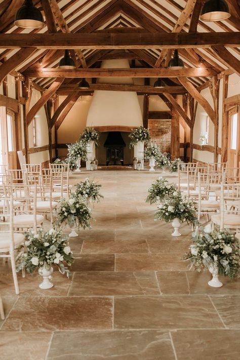 Wedding ceremony aisle of aisle with elegant, classic floral arrangement in green and cream. At romantic, rustic and luxurious barn wedding venue, Abbey Farm Weddings. Farm Wedding Isles, Classic Wedding Venue Ideas, White Floral Wedding Aisle, Meadow Flowers Wedding Aisle, White Flowers Lining Aisle, Castle Farms Wedding, Classic Wedding Ceremony, Wedding Area, Rustic Wedding Venues Uk