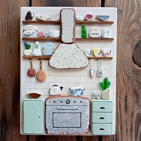 Beach finds art by Angie S. on Instagram: "I just listed this beautiful kitchen wall hanging artwork on Etsy! 😊 It's all made with sea glass, sea pottery and sea tiles on a driftwood piece painted old white. There are so many pretty details on it, such as the sea tile cooking stove and cooker hood, the sea pottery and sea glass kitchenware and the driftwood cupboards! More photos in my Etsy shop (link in bio) Have a wonderful weekend!! ❤️❤️❤️ #seaglassart #seaglasslover #seaglass #seaglassdeco Sea Tiles, Beautiful Kitchenware, Sea Glass Diy, Sea Glass Artwork, Sea Glass Art Diy, Sea Glass Decor, Sea Glass Mosaic, Sea Glass Art Projects, Have A Wonderful Weekend