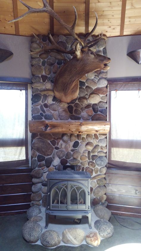 River Rock Behind Woodstove, Wood Stove Hearth Wood Storage, River Rock Wood Stove, Wood Stove Rock Surround, Wood Burning Stove Rock Wall, Rock Hearth For Wood Stove, River Rock Wood Stove Surround, Wood Stove Stone Wall, Woodstove Hearths