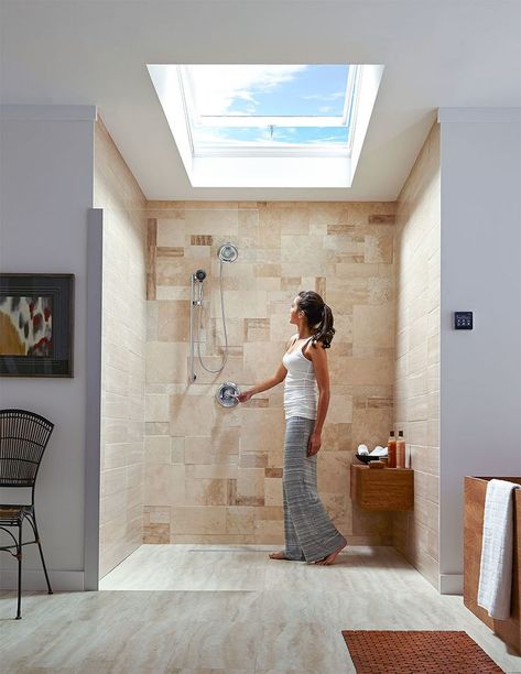 Woman looking up at an open skylight above a modern-looking shower. Shower Skylight Ideas, Skylight Bathroom Ideas, Skylight Shower Ideas, Bathroom Skylight Ideas Ceilings, Bathroom Skylight Ideas, Skylight In Bathroom, Skylight Lighting, Shower With Skylight, Bathroom With Skylight