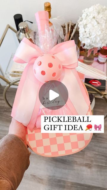 Shelby | Gift-in-a-Box Guide on Instagram: "How to make this cute pickleball birthday gift (or valentines gift with a few tweaks 😉) 

Pickleball is allll the rage right now so I love making it a fun gift idea for the girlies who are already pickleball obsessed OR the ones who have never tried it! 

The paddles can be hard to wrap so just shoving it in a gift bag can be kind of.. well… yawn 🥱 here’s a cute alternative way to wrap it! 

Comment LINKS for the printable gift tag, pickleball pouch and everything else I used to put this gift together 🎀

#pickleball #pickleballers #pickleballgifts #pickleballgirls #giftideas #giftidea #giftideasforher #giftideaforfriends #pink #pinkgift #pinkgifts #pinkobsessed #gifts #targetfinds #targetdollarspot #targetdollarspotfinds #targetdollarsection # Pickle Ball Gift Ideas, Pickleball Gift Basket, Pickleball Gift Ideas, Pickleball Birthday, Auction Basket, Auction Baskets, Secret Pal, Birthday Basket, Raffle Baskets