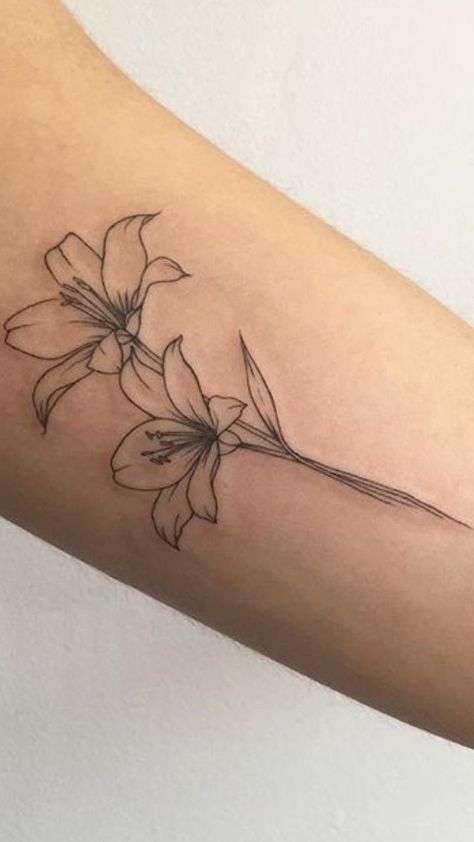 Tattoos Lily Flower, Linework Lily Tattoo, Tigerlily Flower Tattoo, Surprise Lily Tattoo, Tattoo Of A Lily Flower, Dainty Daffodil Tattoo With Name, Flower Lilly Tattoo, Amarilys Flower Tattoo, Minimal Lily Flower Tattoo