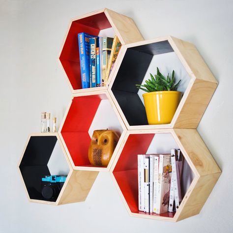 Orange Hexagon Bookshelf | dotandbo.com. I could do with a few of those for storage and to create an interesting wall feature. Honeycomb Shelves, Hexagon Shelves, Dorm Room Designs, Modern Bookcase, Modern Diy, Book Shelf, Wall Shelves, Home Interior, Honeycomb