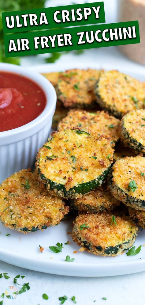 This quick and easy breaded crispy Air Fryer Zucchini Chips recipe makes an excellent low-carb appetizer or side dish. Sliced zucchini is coated in breadcrumbs, Parmesan cheese, and Italian seasoning then air fried to crunchy perfection. Dip in marinara for a healthy kid-friendly dish! Air Fryer Zucchini Slices, Fried Zucchini Slices, Healthy Fried Zucchini, Sliced Zucchini Recipes, Zucchini Ideas, Air Fryer Zucchini Chips, Salad Challenge, Fried Zucchini Recipes, Sliced Zucchini