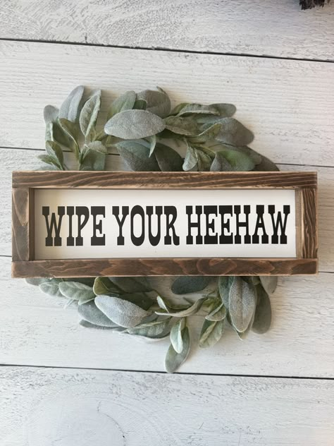 Wipe your Heehaw! The perfect sign to place above your toilet in your western themed bathroom!  Sign is size 4.5x13 inches. White background with black lettering. sign stands on its own but also hangs! wreath and backdrop not included. Western Powder Room Ideas, Western Primitive Decor, Black And White Rustic Decor, Farm Wood Signs, Diy Western Bathroom Decor, Western Bedroom Signs, Western Home Diy Ideas, Western Rv Decorating Ideas, Rustic Western Kitchen Decor