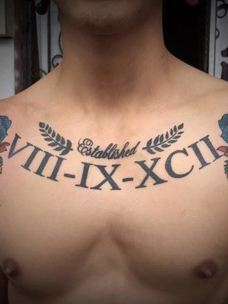 20 Roman Numerals Tattoo for Men in 2021 - The Trend Spotter Lopez Tattoo Last Name, Roman Numeral Chest Tattoo, Mens Roman Numeral Tattoo, Chest Tattoo Words, Chest Tattoo With Meaning, Roman Numerals Tattoo, Tato Nama, Last Name Tattoos, Numerals Tattoo