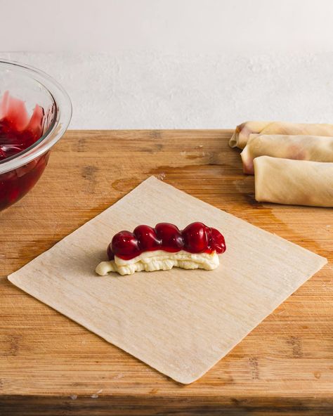 Cherry Cheesecake Egg Roll recipe - Happy Homeschool Nest Cheesecake Spring Rolls, Cherry Egg Rolls, Cherry Cream Cheese Egg Rolls, Egg Roll Wrapper Recipes Easy, Desert Egg Roll Recipes, Sweet Egg Rolls, Cherry Cheesecake Egg Rolls, Dessert Egg Roll Recipes, Dessert Egg Rolls Recipe