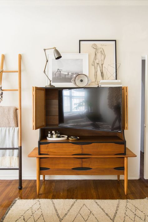 12 Clever Hidden TV Ideas - How to Hide a TV, According to Top Designers Tv Solutions, Tv Hutch, Media Room Design, Hidden Tv, Tv Screen, Tv In Bedroom, Bifold Doors, Scandinavian Home, Tv Cabinets