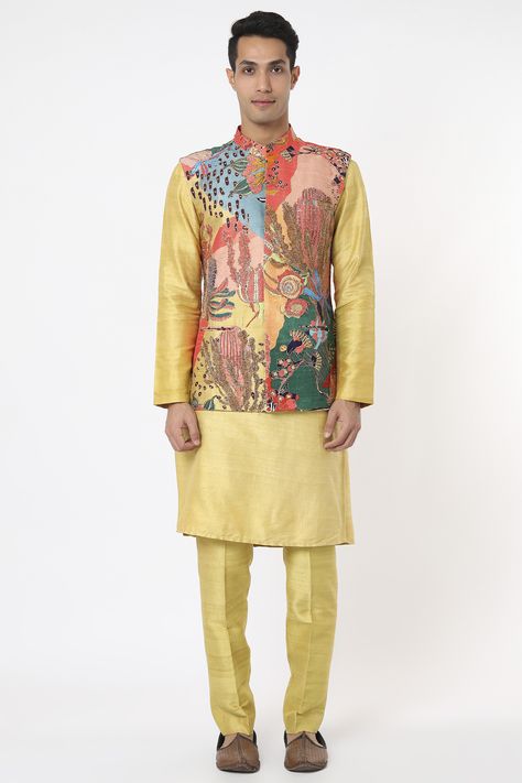 Featuring a multi-colored bundi jacket in raw silk base with print and embellishment. It is paired with a contrasting yellow kurta and pants. #perniaspopupshop #whatiworewastrending #ppuslove #aisharao #rakhi #teej #festivewear #multi-colouredbundijacket #bundijacketwithkurtaset #embellishedjacket Dhoti Pants For Men, Aisha Rao, Kurta And Pants, Waistcoat Designs, Mens Indian Wear, Yellow Kurta, Indian Groom Wear, Gents Kurta Design, Gents Kurta