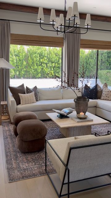 Jaci Daily shared a post on Instagram: "Coffee table switch up! With all the wood that we have going on in this room adding a stone element was exactly what this space needed! Travertine is becoming a slight obsession of mine and I’m not mad about it. Table: @mcgeeandco Sources: linked in my bio #livingroom #falldecor #livingroomdecor #travertine #interiordesign #homedecor #reels #designinspo". Follow their account to see 1253 posts. Coffee Table Setting Ideas, Travertine Dining Table Styling, Travertine Coffee Table Living Room, Double Coffee Table Living Rooms, Living Room Black Coffee Table, Studio Mcgee Coffee Table, Stone Coffee Table Living Room, Travertine Furniture, Jaci Daily