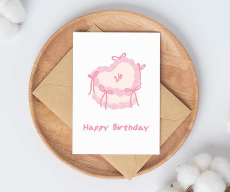 This flirty aesthetic birthday card is perfect for teenage girls on their sweet sixteen. Featuring a cute pink bow birthday cake, this card is simple and classy for her 16th birthday party or celebration. Perfect for teenage daughter, card for granddaughter, or birthday gift for friend. ✰ ✰ ✰ ABOUT THE PRODUCT ✰ ✰ ✰ - Size: 4.25 x 5.5 closed (8.5 x 5.5 opened) - Includes kraft brown envelope (self-seal) - All cards are blank on the inside ✰ ✰ ✰ GIFT MESSAGES ✰ ✰ ✰ Want to add a personalized mess 17 Birthday Card, Pink Bow Cake, Bow Birthday Cake, Flirty Aesthetic, 20th Birthday Card, Coquette Birthday, Birthday Cards For Girlfriend, 16th Birthday Card, Bow Birthday