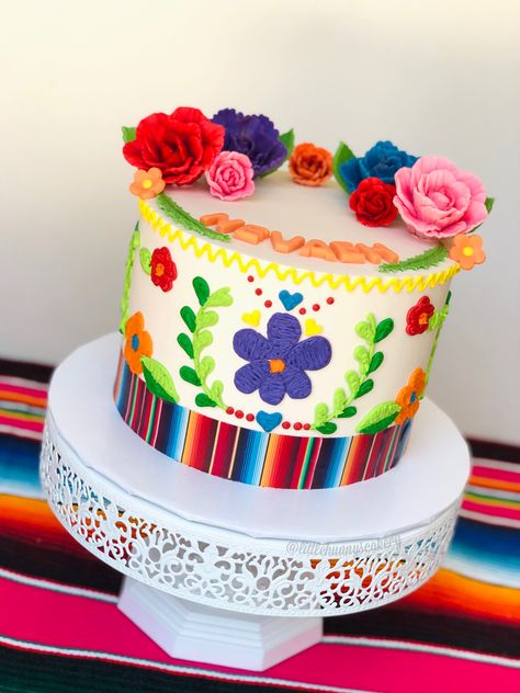 Mexican embroidered cake with buttercream. Edible image serape and handmade fodant flowers. #mexicanembroidery #mexicanembroiderycake #cake #colorfulcake #fiestacake #fiesta #serape #serapetheme #serapecake #sugarflowers #edibleimage Mexican Themed Cakes, Mexican Fiesta Cake, Exquisite Cakes, Mexican Fiesta Birthday Party, Mexican Cake, Mexican Baby Shower, Mexican Birthday Parties, Fiesta Cake, Fiesta Birthday Party