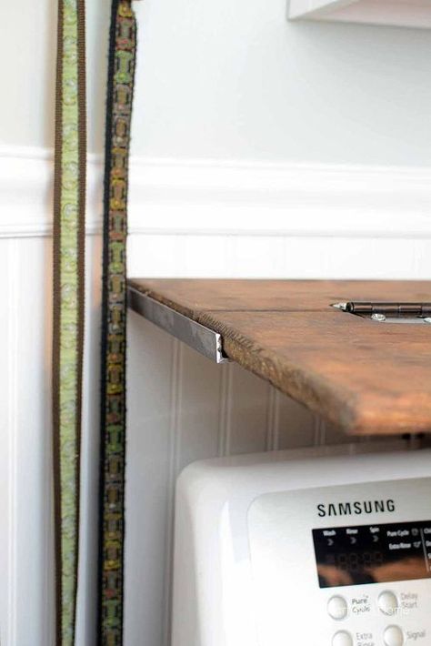 This DIY Rustic Folding Shelf opens to double in size - which is really great for laundry day! Start with 2 pieces of wood cut to the size you want your shelf...soften the edges with a router... You'll need 3 hinges for a 6 foot shelf...Mark where your hinges will go... Chisel out the place for your hinges...you'll want the hinges to fit flush in the wood... Sand the chiseled place to smooth... This is how your hinges will be attached...but DON'T attach them yet...first (i… Rustic Corner Shelf, Folding Shelf, Rustic Outdoor Furniture, Laundry Shelves, Outdoor Furniture Diy, Shelf Diy, Rustic Furniture Diy, Shelving Ideas, Build Floating Shelves