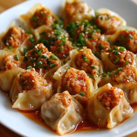 🥟🌶️ Enjoy the bold flavors of Kimchi Mandu, spicy kimchi dumplings! A Korean delight! 🥢✨ #KoreanCuisine #DumplingLove Kimchi Mandu (Kimchi Dumplings) Ingredients: Kimchi (1 cup, chopped) Ground pork (1/2 lb) Tofu (1/2 cup, crumbled) Garlic (2 cloves, minced) Green onions (2, chopped) Soy sauce (1 tbsp) Sesame oil (1 tsp) Dumpling wrappers (20) Salt and pepper (to taste) Instructions: Mix kimchi, pork, tofu, garlic, green onions, soy sauce, sesame oil, salt, and pepper. Place a spoonful of... Mandu Recipe, Korean Dumplings, Dumpling Wrappers, Twisted Recipes, Catering Ideas Food, Trending Recipes, Ground Pork, Kimchi, Korean Food