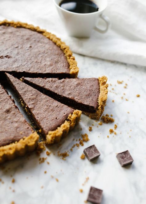 Fudgy Brownie Tart by Wood and Spoon by Kate Wood. This is a graham cracker press in butter crust with a melted chocolate and cocoa powder brownie milk tart. It's rich with the addition of Red Diamond Coffee and tastes best with a. sprinkle of flaky sea salt. Learn more about this simple holiday dessert recipe for a crowd on thewoodandspoon.com. Brownie Tart, Caramel Crumble, Holiday Dessert Recipes Easy, Cocoa Powder Brownies, Cinnamon Cereal, Easy Holiday Desserts, Fudgy Brownie, Mexican Chocolate, Thrive Market