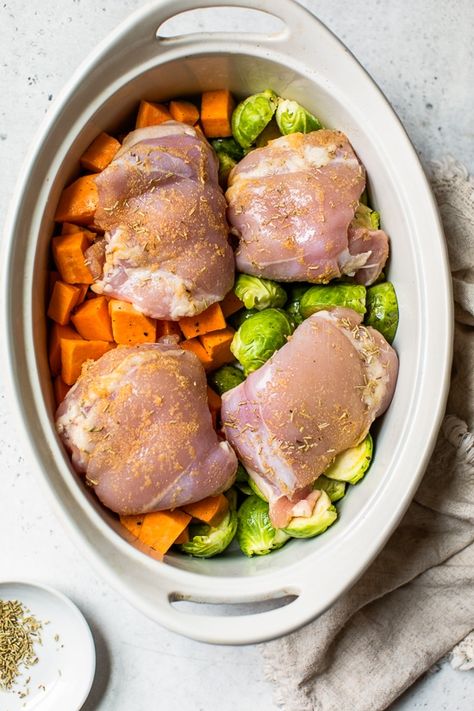 Baked Chicken Thighs with Brussels Sprouts and Sweet Potato, a quick and easy one-pot chicken dinner for a chilly, fall night. #onepotchicken #chicken #chickendinner #onepotrecipes #brusselssprouts #butternut Crock Pot Sweet Potatoes, Crockpot Chicken Thighs, Fall Night, Chicken Sweet Potato, Baked Chicken Thighs, Healthy Crockpot, Crockpot Recipes Slow Cooker, Chicken Dishes Recipes, Sweet Potato Recipes