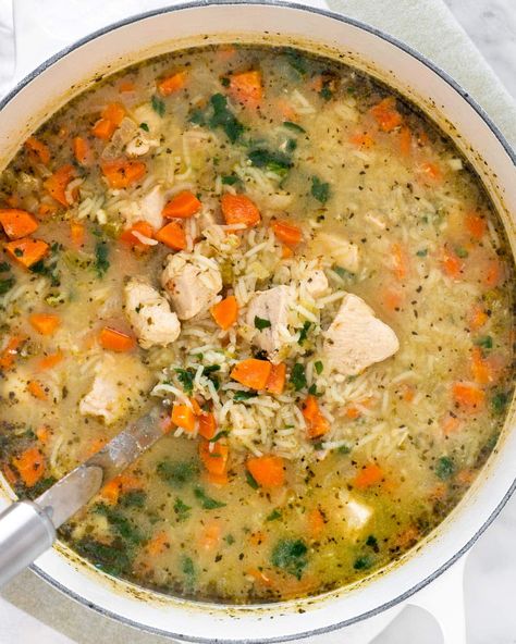 This Chicken and Rice Soup is comforting made with everything you need in a meal. Protein, carbs, and lots of veggies! It'll leave you warm and filled up after just one bowl. #chicken #rice #soup #recipe Mirepoix Recipe, Oven Chicken And Rice, Dutch Oven Soup Recipes, Dutch Oven Chicken Breast, Dutch Oven Soup, Dutch Oven Recipes Cast Iron, Chicken Veggie Soup, Bowl Chicken, Dutch Oven Chicken