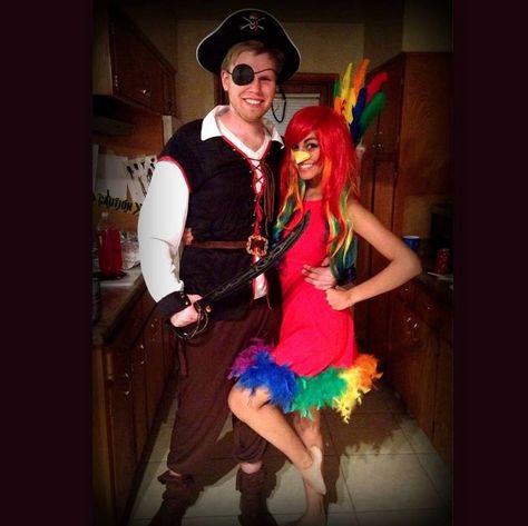 Halloween Couple Costume!! Pirate and parrot! Parrot Costume Women, Parrot Costume Diy Women, Pirate And Parrot Costume Couple, Pirate And Parrot Costume, Homemade Parrot Costume, Pirate Parrot Costume, Women’s Parrot Costume, Pirate With Parrot, Parrot Costume