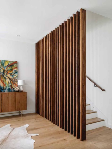 This bright and airy Texas home is focused on sustainable living Mcm Railing, Stacked Stairs, Mcm Staircase, Living Room With Stairs Layout, Slat Stairs, Room Division, Case Study Houses, House Staircase, Entry Stairs