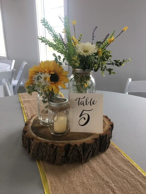 Rustic Wedding Centerpieces Sunflowers, Burlap And Sunflower Table Decorations, Centerpieces With Sunflowers Simple, Sunflower Mason Jar Wedding Centerpieces, Sunflower And Sage Green Centerpieces, Mason Jar Centerpieces Sunflowers, Sunflower And Burlap Wedding, Wood And Flower Centerpieces, Sunflower Mason Jar Centerpieces Diy