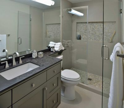 In the master bath, designer Carla Aston replaced the tub with a full-size shower lined with subway tile and river rock. Like the rest of Ryan Hutson's home, she wanted it masculine and unfussy. Photo: Miro Dvorscak / Miro Dvorscak Photography Bachelor Bathroom, Contemporary Remodel, Farmhouse Bathroom Mirrors, Storage Inspiration, Over Toilet, Great Bathrooms, Bathroom Images, Bathroom Remodel Designs, Contemporary Bathrooms