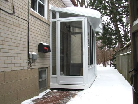 side door enclosure, used as a vestibule to a home office. Basement Sunroom, Retaining Wall Pavers, Porch Enclosure, Bilco Doors, Basement Refinishing, Modern Front Porches, Small Extension, Sas Entree, Patio Stairs