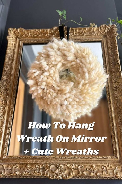 How To Hang Wreath On Mirror + Cute Examples - Pink Pop Design Mirrors With Wreaths, Christmas Wreath Over Mirror, How To Hang Wreath On Mirror, Mirror Wreath Decor, Wreath On Mirror Ideas, Wreath On Mirror Christmas, How To Decorate A Mirror For Christmas, Christmas Wreath On Mirror, Wreaths On Mirrors