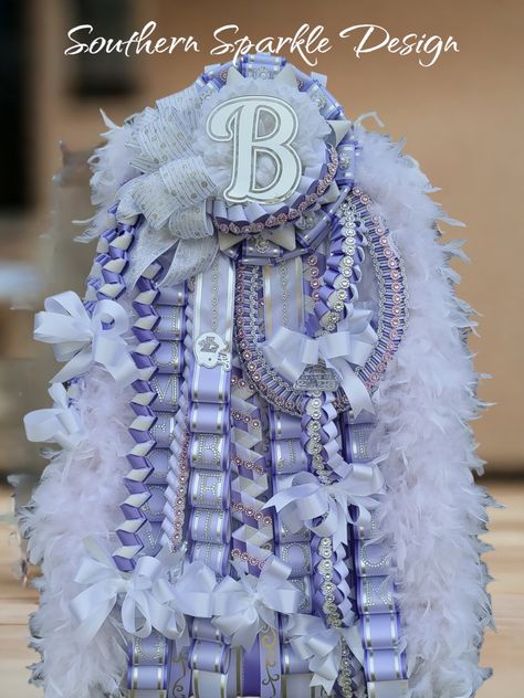 Homecoming mum's Purple And White Homecoming Mum, Purple Gold Homecoming Mum, Mobius Braid Homecoming Mum, Hot Pink Homecoming, Love Chain Braid Mum, Homecoming Mum Name Chain, Homecoming Mums Diy, Mums The Word, Senior Activities