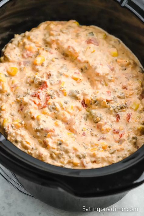 Crock Pot Cowboy Crack Dip is the perfect dip to serve for any occasion. You only need a few ingredients to make this flavorful dip. This spicy and creamy dip is a crowd favorite. It is perfect for large crowds and perfect for dipping your favorite tortilla chips in. #eatingonadime #crockpotcowboycrackdip #cowboycrackdip Ranchero Party, Spicy Sausage Dip, Queso Dip Crockpot, Slow Cooker Dip Recipes, Dip Recipes Crockpot, Slow Cooker Dips, Chip Dip Recipes, Sausage Dip, Crock Pot Dips